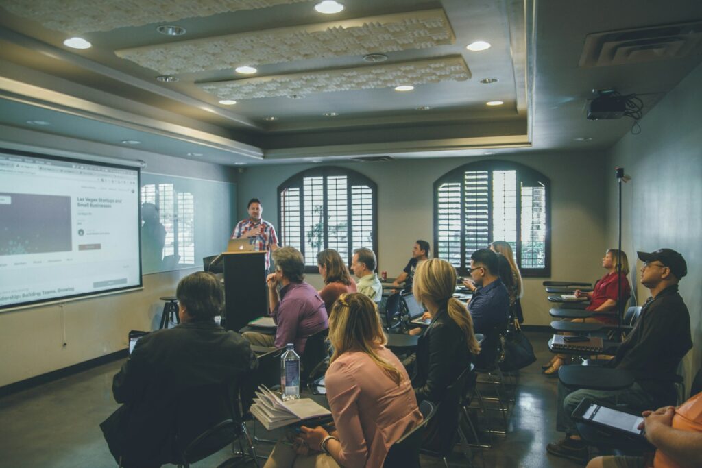 Group attending a workshop with a projector screen