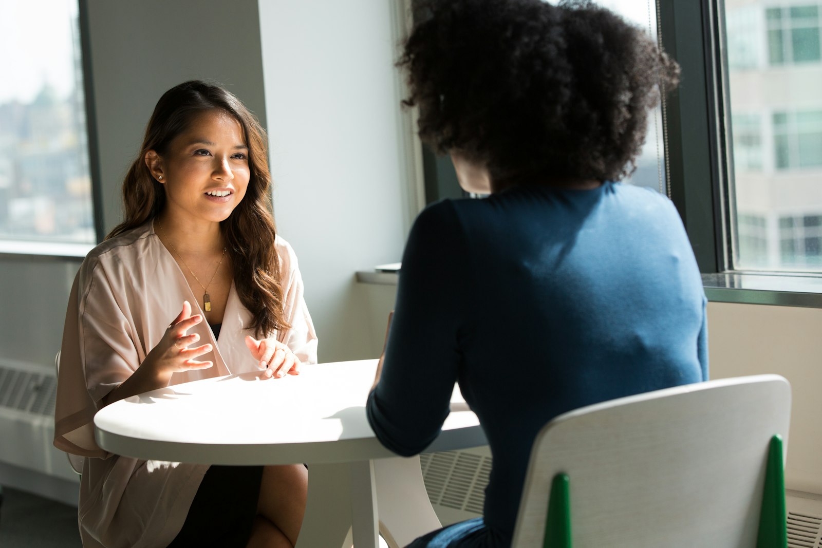 Two colleagues talking during an onboarding conversation