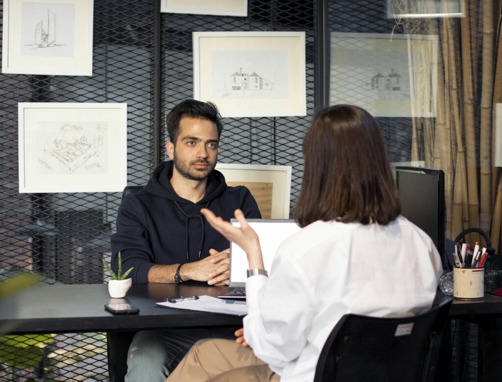 Recruiter and candidate in conversation at a desk